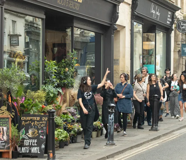 Guide conducting bridgerton bath tour with music